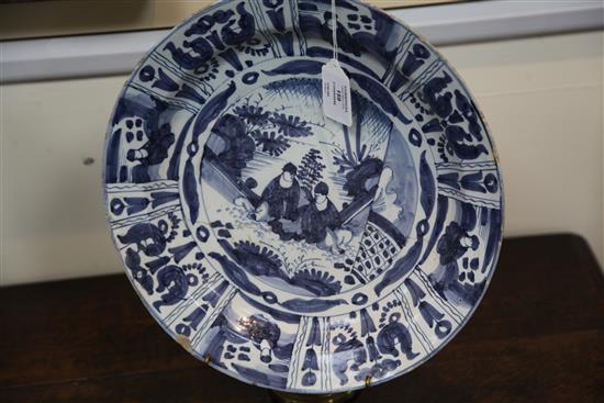 Two Dutch Delft blue and white chargers, c.1690-1700, 34cm and 39.5cm, some damage